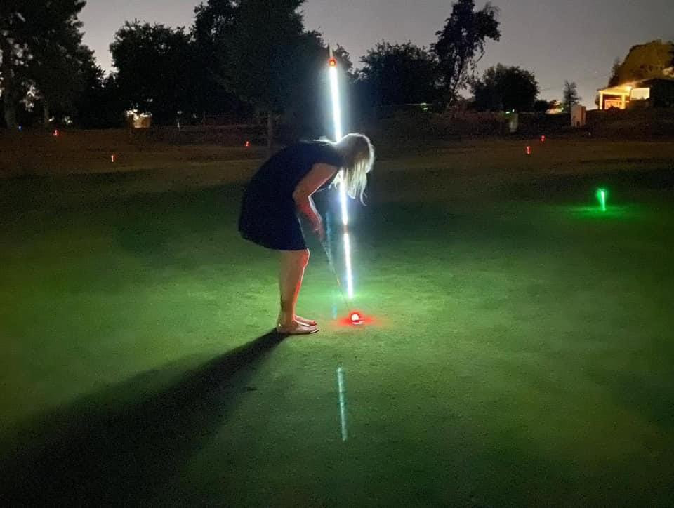 glow golf woman putting